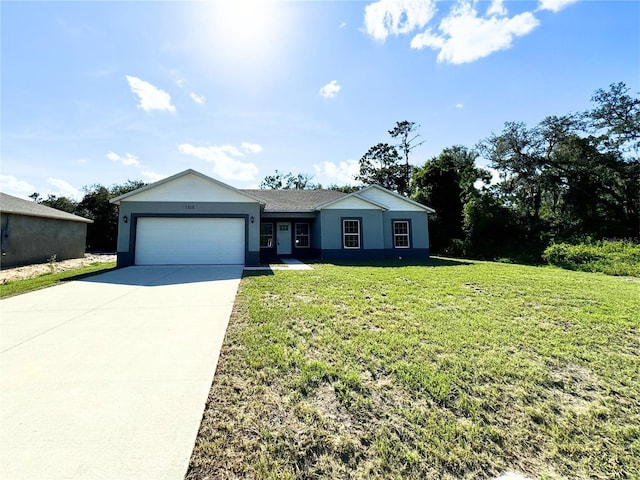 single story home with a garage and a front lawn