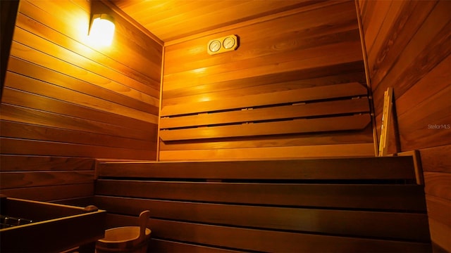 view of sauna / steam room with wood ceiling and wood walls