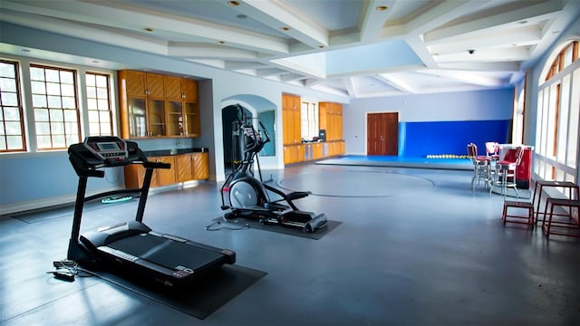 exercise room featuring vaulted ceiling