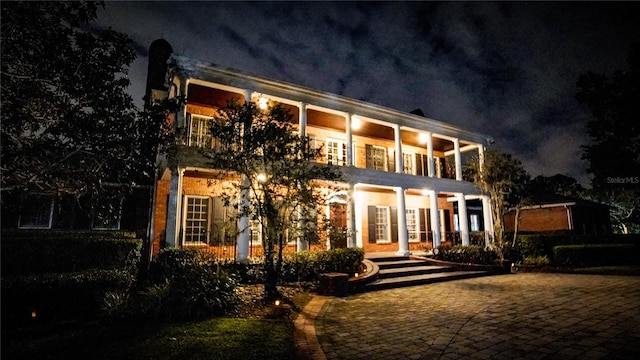 view of back house at night