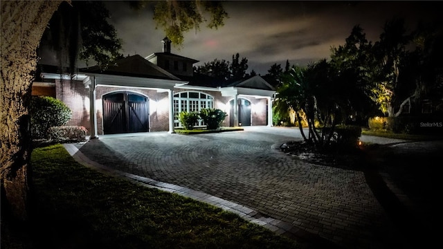 ranch-style house featuring a garage