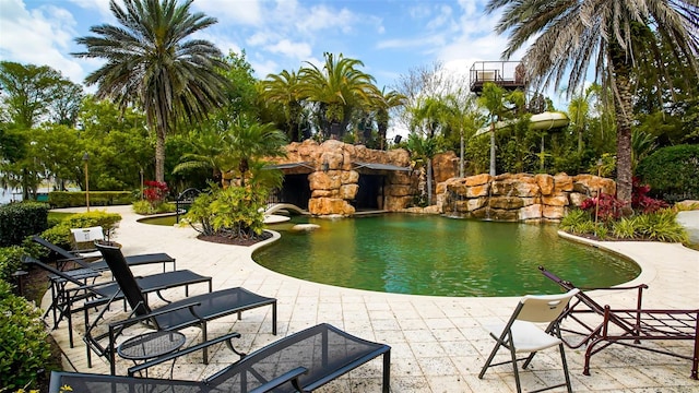 view of swimming pool with a patio