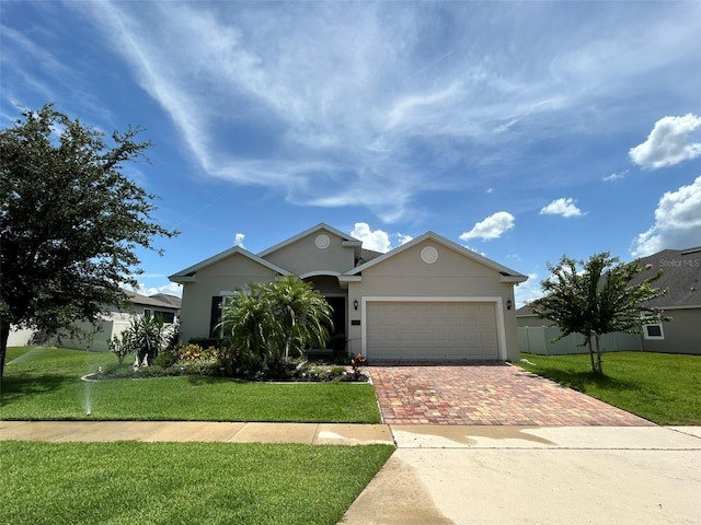 view of front of property featuring a garage and a front yard