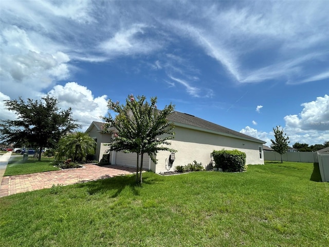 view of side of property featuring a yard