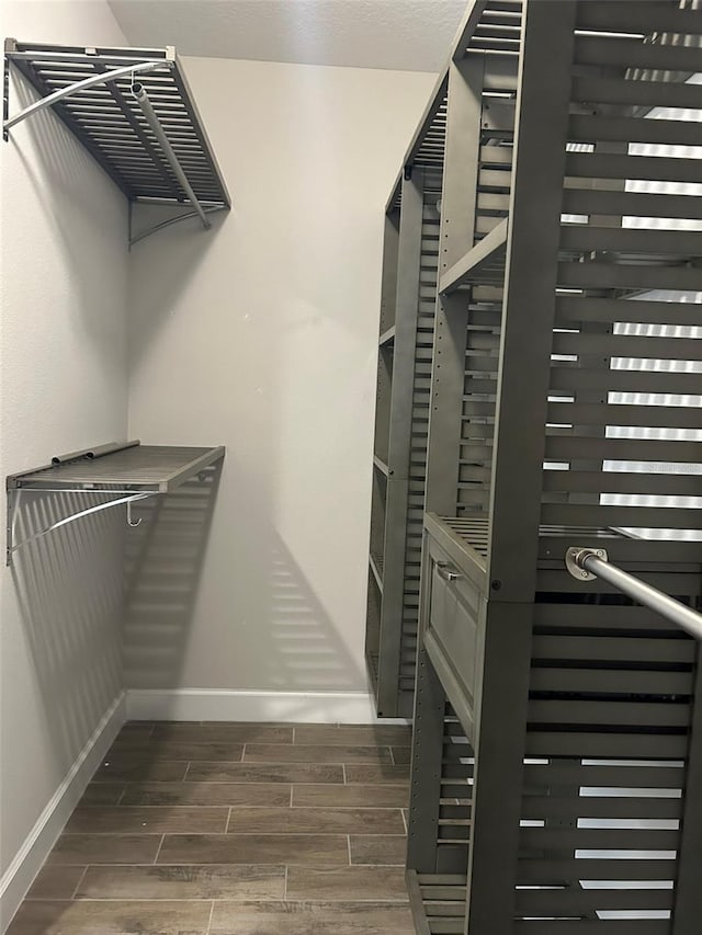 spacious closet featuring hardwood / wood-style floors