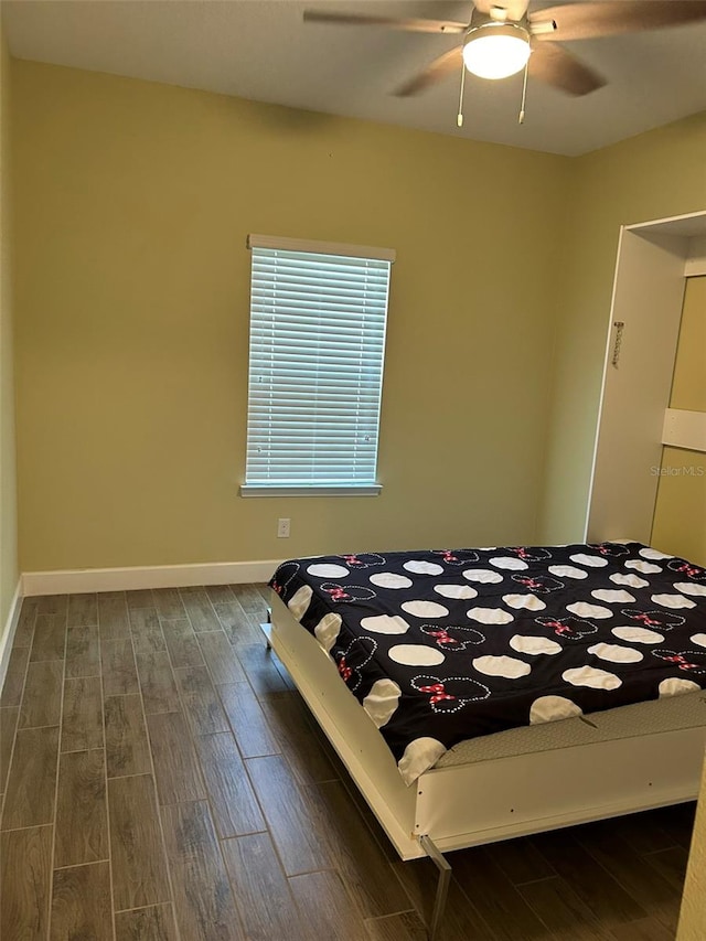 unfurnished bedroom with ceiling fan and wood-type flooring