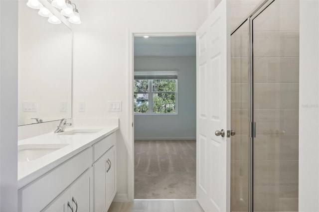 bathroom with vanity and walk in shower