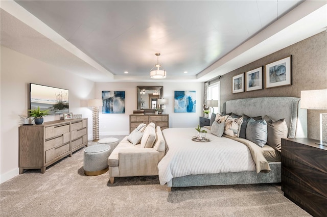 carpeted bedroom featuring recessed lighting, a raised ceiling, and baseboards