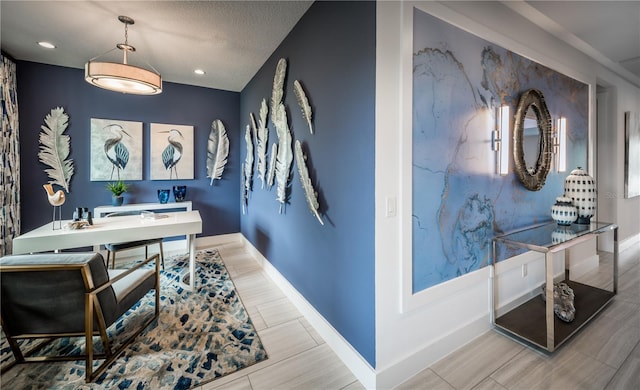 office space with baseboards, a textured ceiling, and recessed lighting