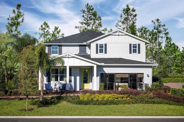 2424 Park Ridge St, Apopka, FL 32712 - view of front of house featuring covered porch, a shingled roof, and a front lawn