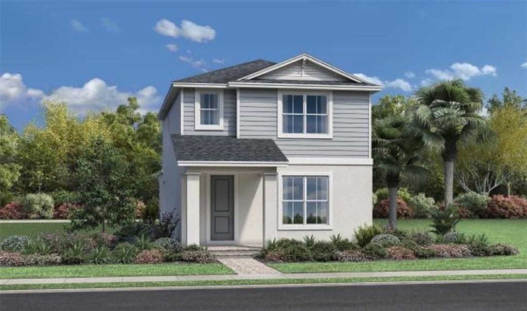 traditional-style house with a shingled roof and stucco siding