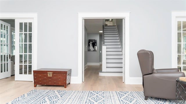 office space featuring french doors and hardwood / wood-style floors