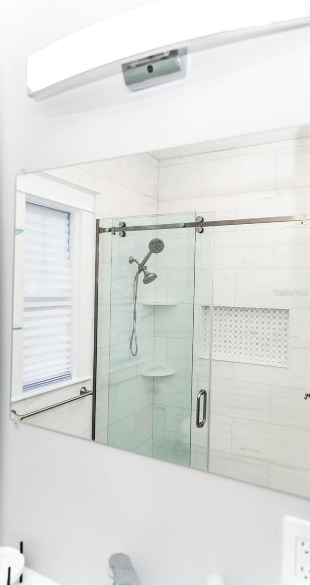 bathroom with an enclosed shower