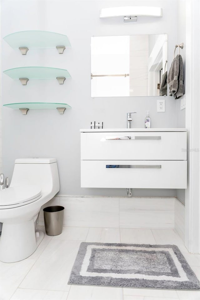 bathroom with vanity and toilet