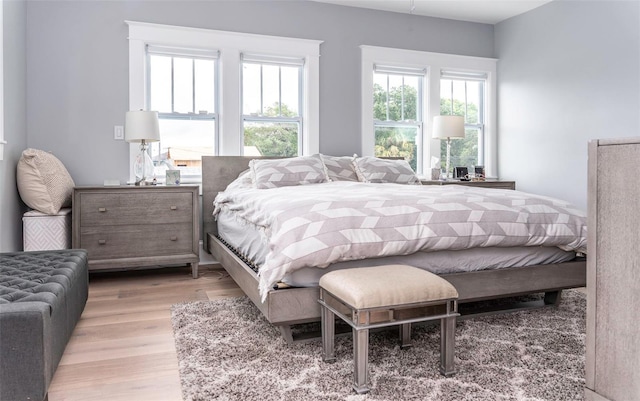 bedroom with light wood-type flooring