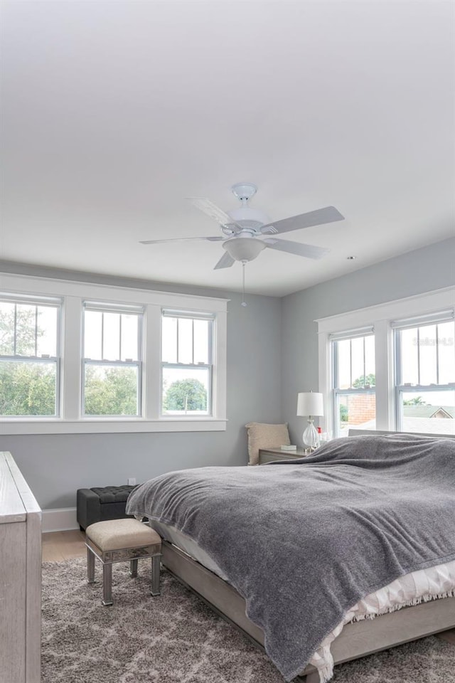 bedroom featuring ceiling fan and wood-type flooring