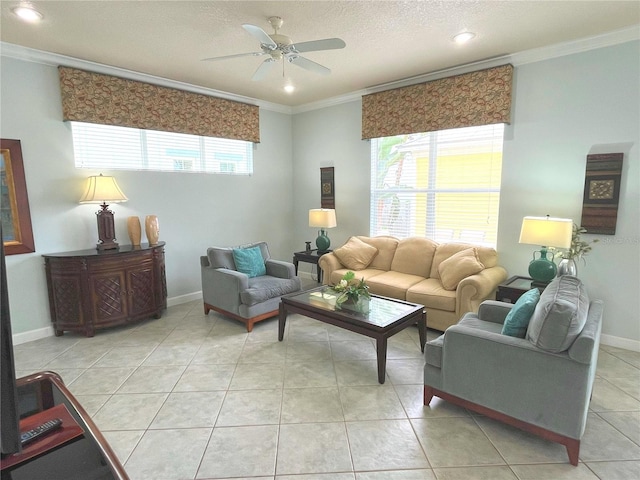 tiled living room with ceiling fan, ornamental molding, and a textured ceiling