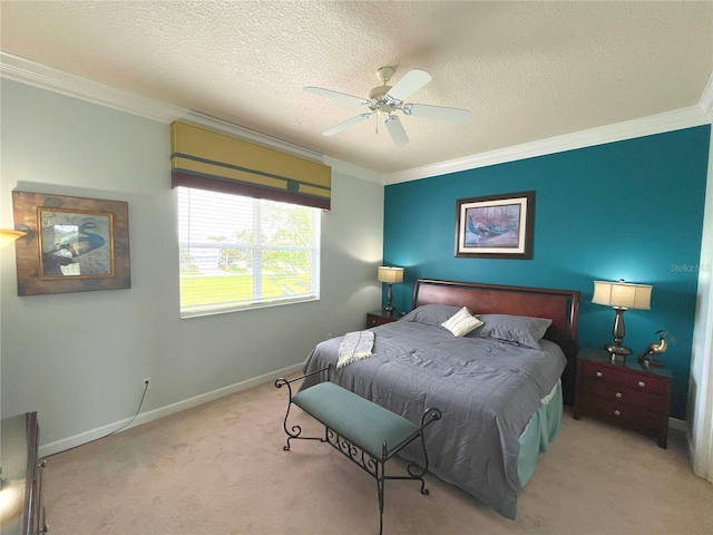 bedroom featuring a textured ceiling, crown molding, and light colored carpet