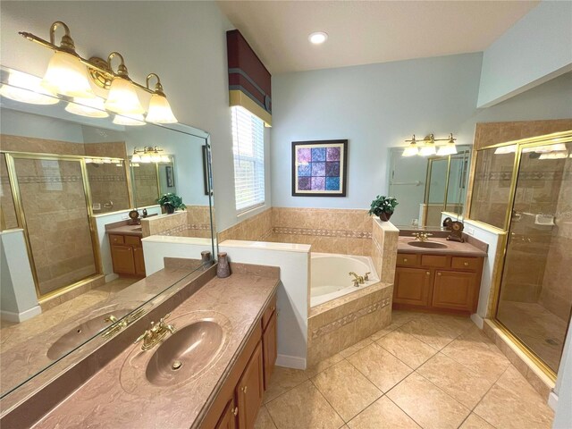 bathroom with tile patterned floors, vanity, and plus walk in shower