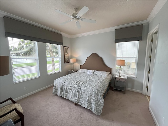 bedroom featuring ceiling fan, crown molding, light carpet, and multiple windows