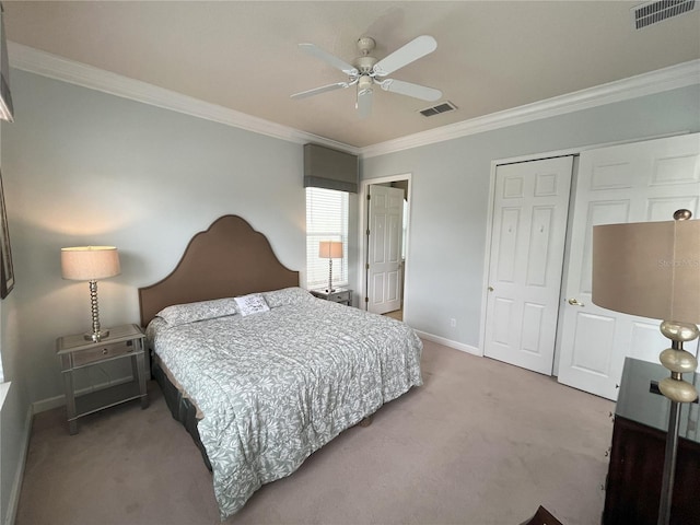 bedroom with ceiling fan, a closet, crown molding, and carpet flooring