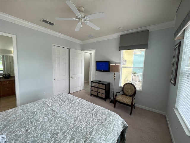 bedroom with light carpet, a closet, ornamental molding, and ceiling fan