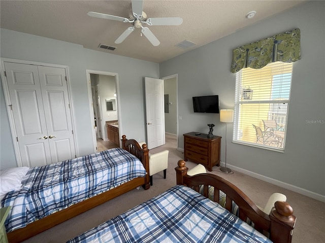 7762 Linkside Loop, Reunion, FL 34747 - carpeted bedroom featuring a closet, baseboards, a ceiling fan, and ensuite bathroom