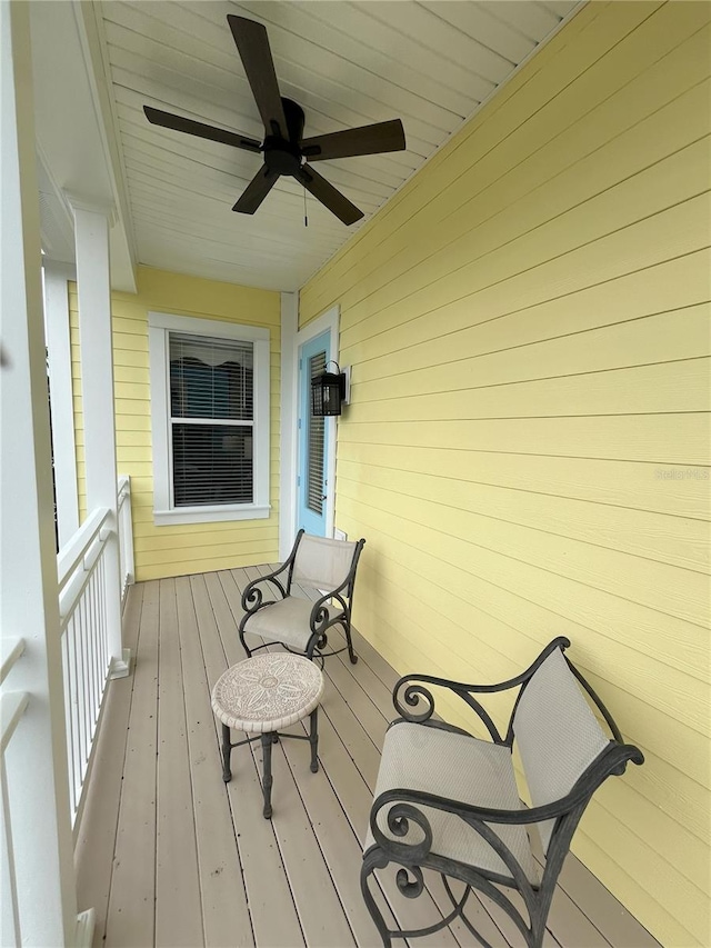 wooden deck with ceiling fan