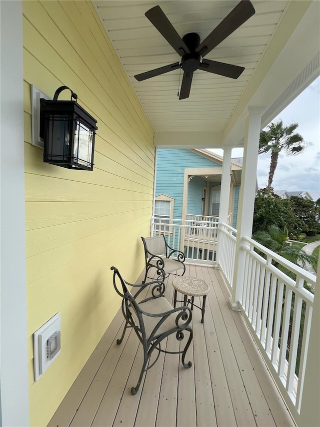 wooden terrace with ceiling fan