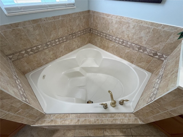 bathroom with tiled tub