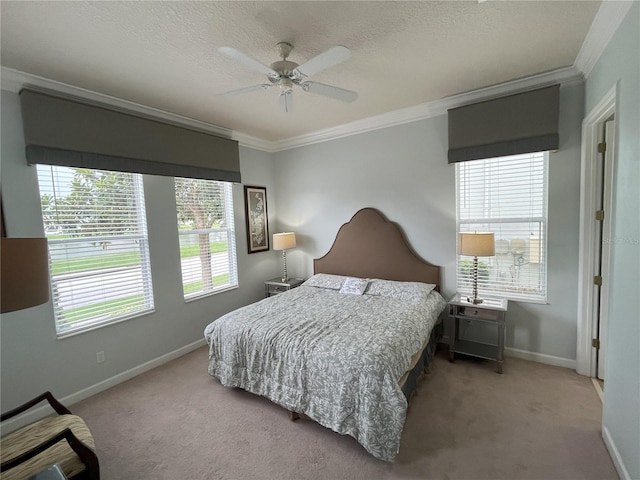 carpeted bedroom featuring a textured ceiling, ornamental molding, multiple windows, and ceiling fan