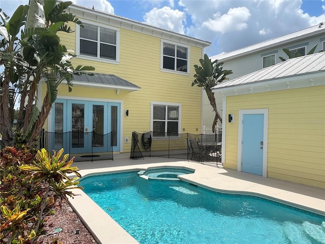 rear view of property featuring french doors and a patio