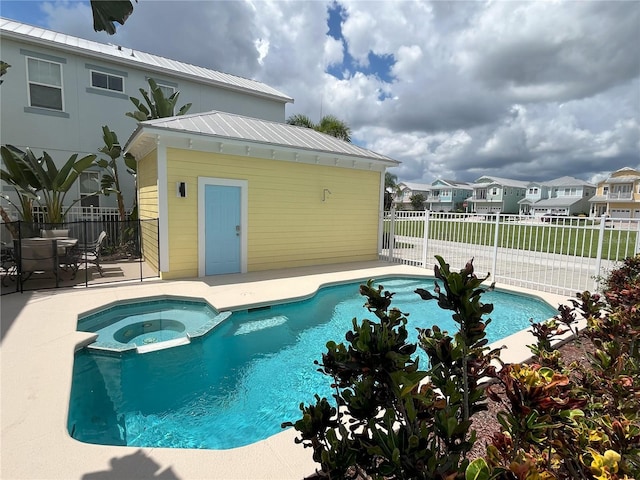 view of pool with an in ground hot tub and a patio