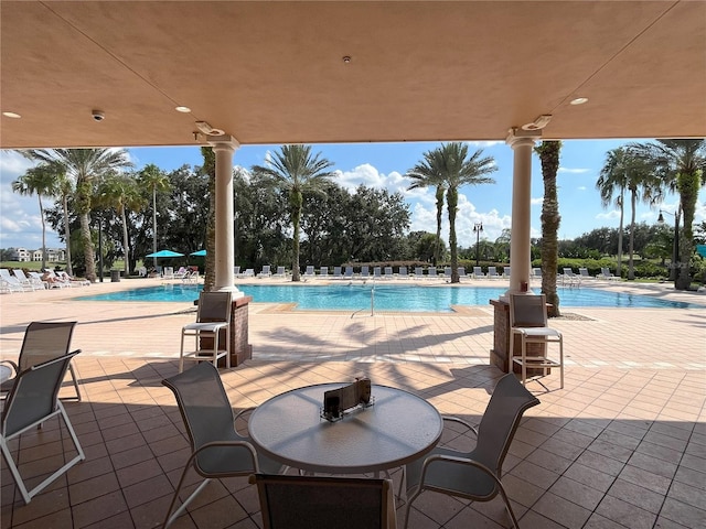 view of swimming pool featuring a patio area