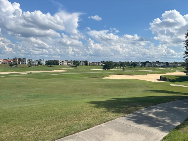 view of home's community featuring a yard