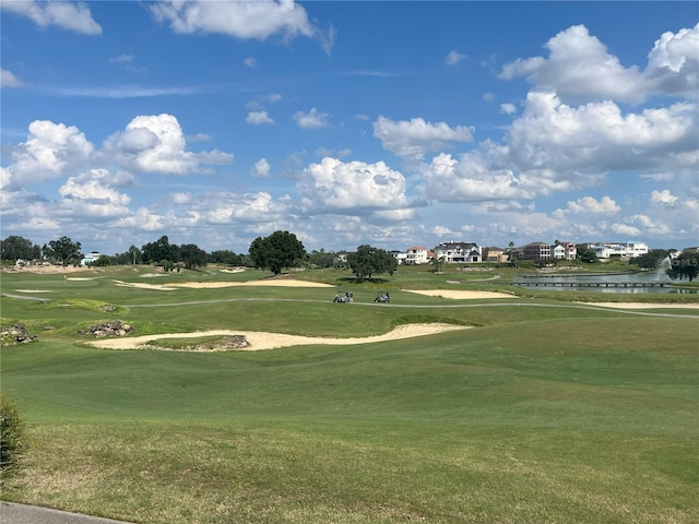 7762 Linkside Loop, Reunion, FL 34747 - view of property's community featuring view of golf course, a water view, and a yard