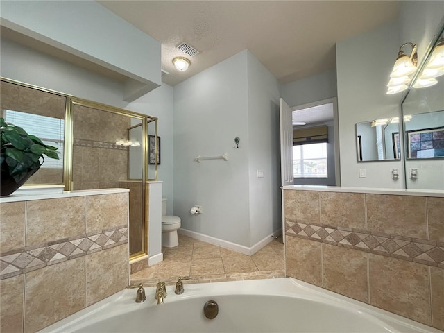 bathroom featuring independent shower and bath, a textured ceiling, and toilet