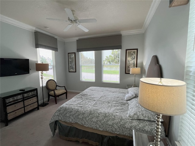 bedroom featuring carpet floors, crown molding, a textured ceiling, and ceiling fan