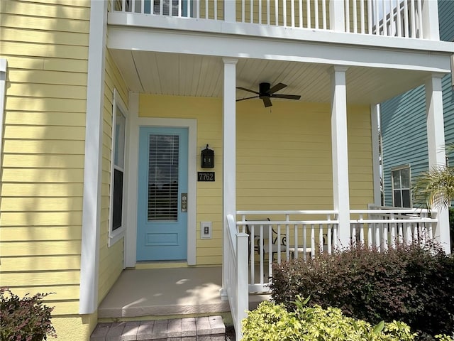 doorway to property featuring ceiling fan and covered porch