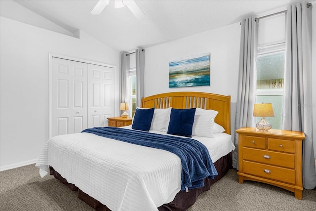 carpeted bedroom with lofted ceiling, ceiling fan, and a closet