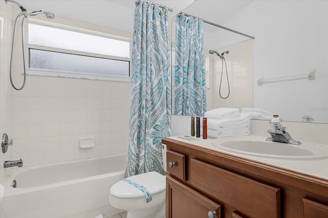 full bathroom with vanity, toilet, and shower / bath combo with shower curtain