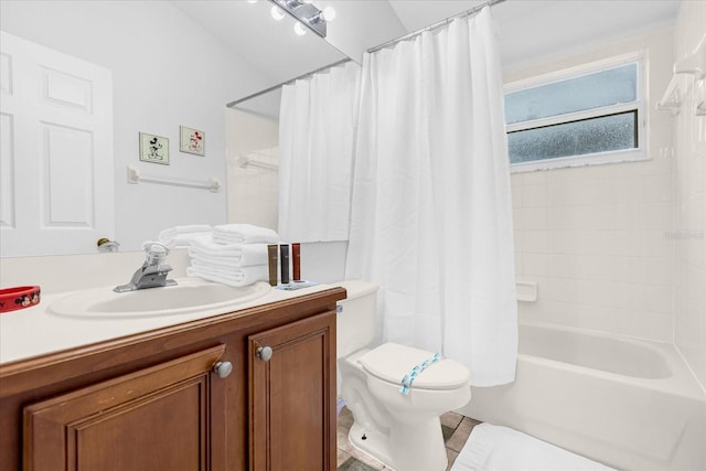 full bathroom featuring vanity, toilet, and shower / tub combo