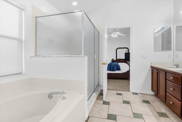 bathroom featuring tile patterned flooring, vanity, ceiling fan, and shower with separate bathtub