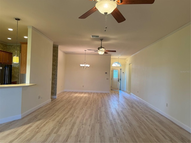 unfurnished living room with ornamental molding, light hardwood / wood-style flooring, and ceiling fan with notable chandelier