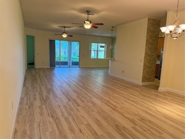 spare room with ornamental molding, ceiling fan with notable chandelier, and light hardwood / wood-style floors