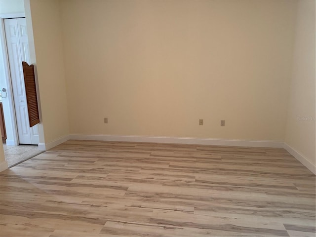 spare room featuring light hardwood / wood-style floors