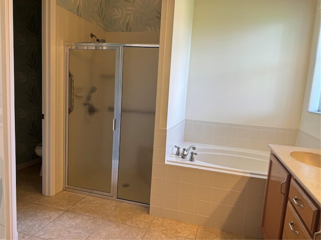 full bathroom with tile patterned floors, vanity, toilet, and separate shower and tub