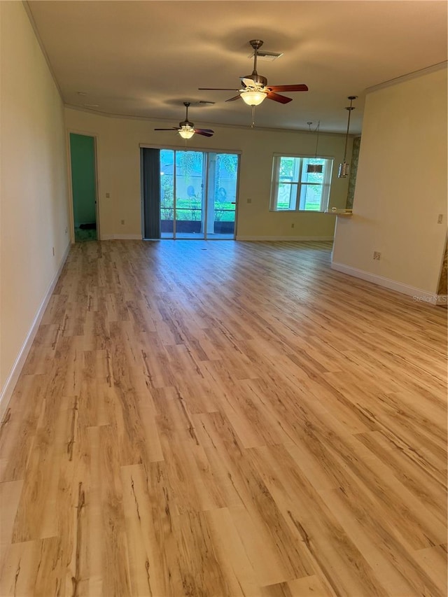 unfurnished room featuring light wood-type flooring and ceiling fan