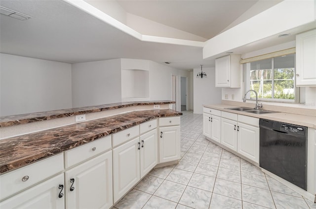 kitchen featuring lofted ceiling, white cabinetry, dishwasher, light tile patterned floors, and sink