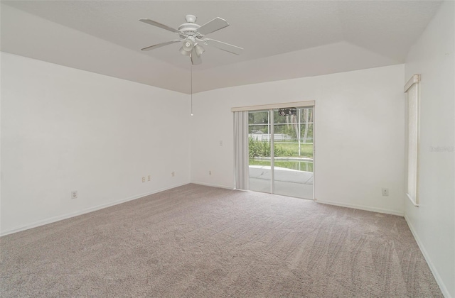 carpeted empty room with ceiling fan and lofted ceiling